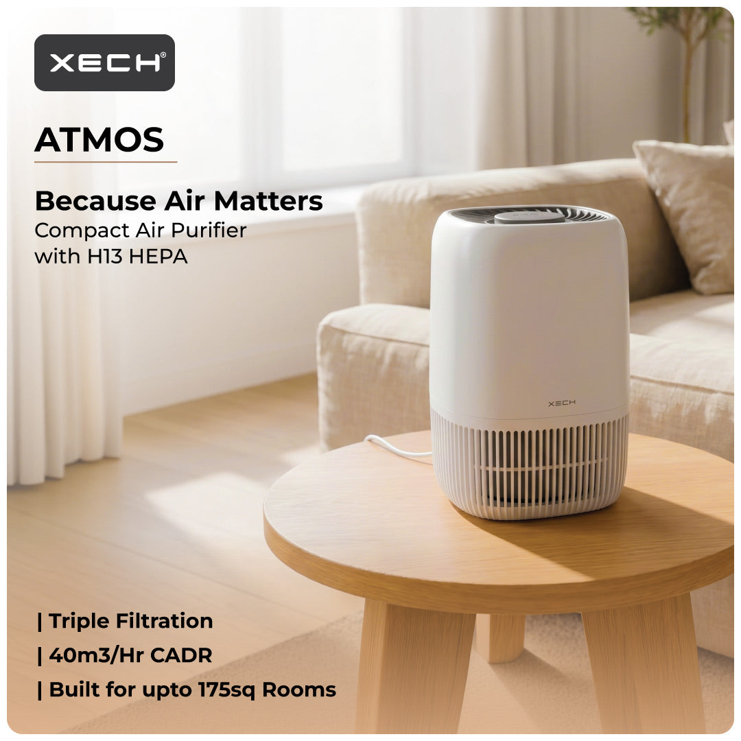 XECH Atmos white compact H13 HEPA air purifier displayed in a warm living room