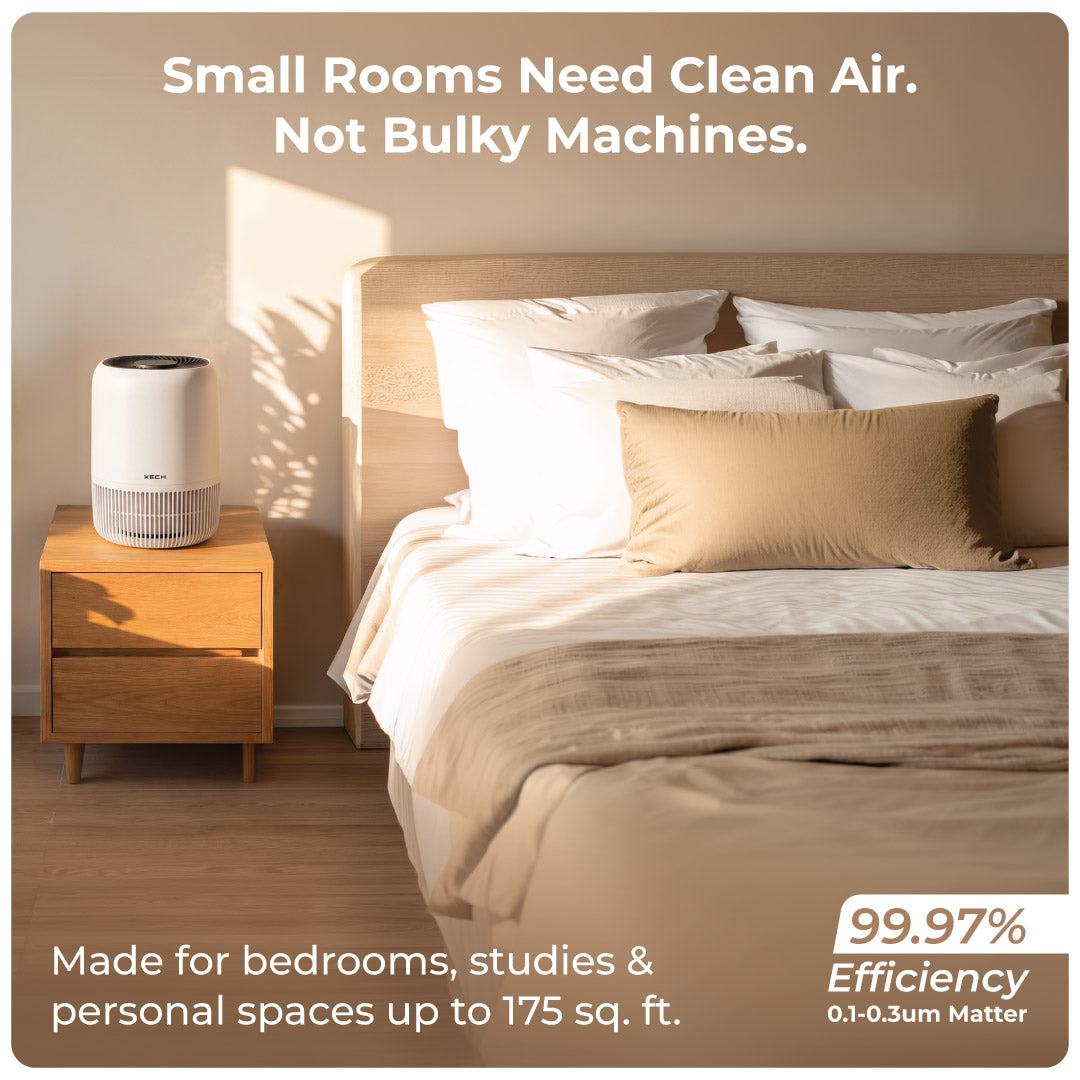 XECH Atmos white air purifier beside a bed for bedrooms and small rooms up to 175 sq. ft.