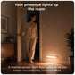 XECH SENSY battery-operated motion sensor light turning on near a bedroom doorway